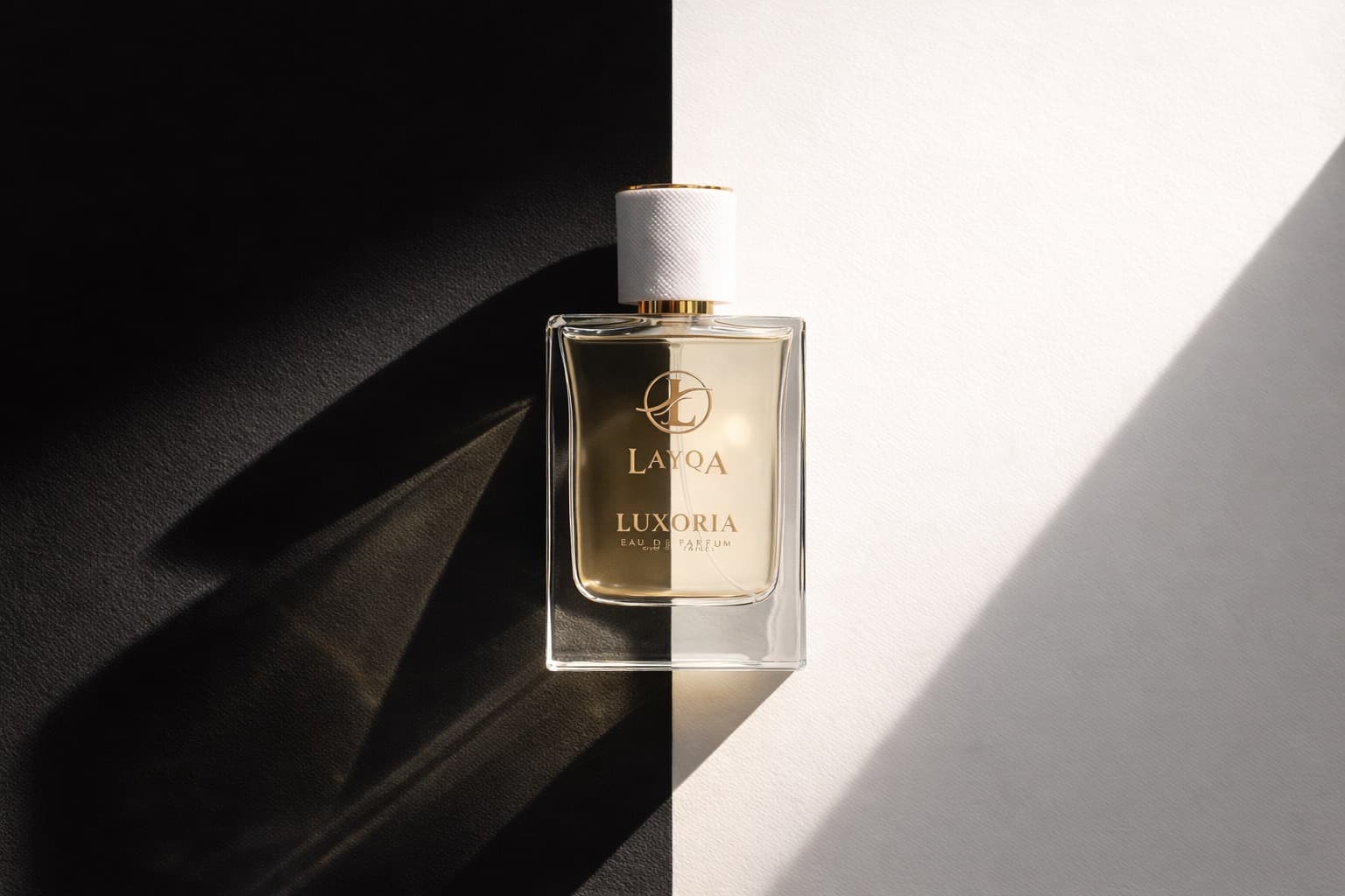 Minimalist still life showing perfume bottle and flowers.