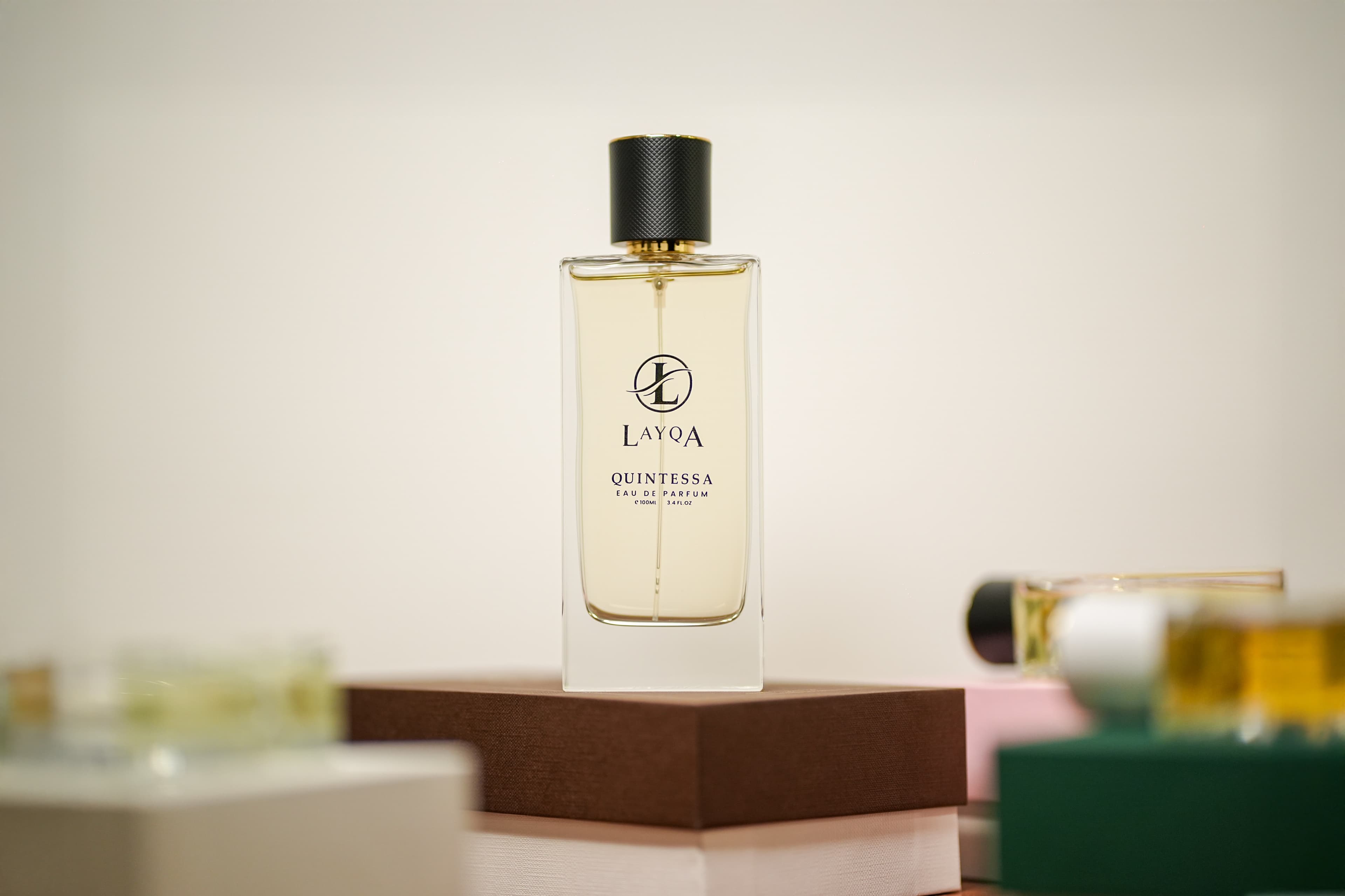 Close-up of perfume spray in motion against dark background.